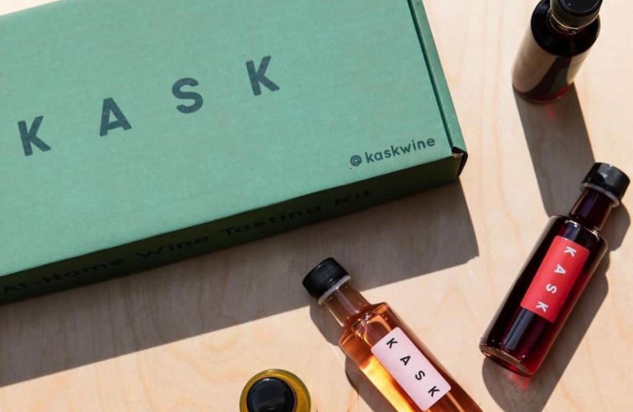 KASK box surrounded by miniature wine bottles