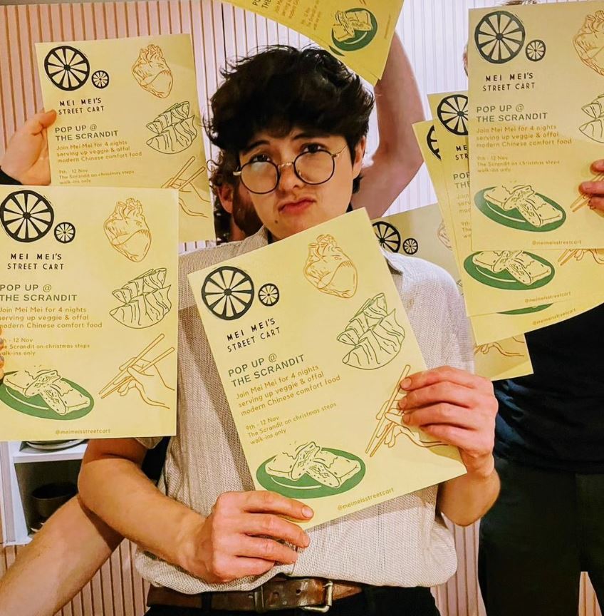 Person holding menus