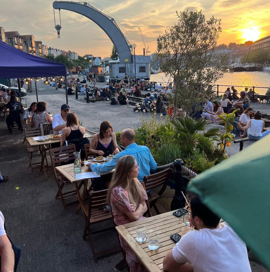 People sat outside Olive Shed