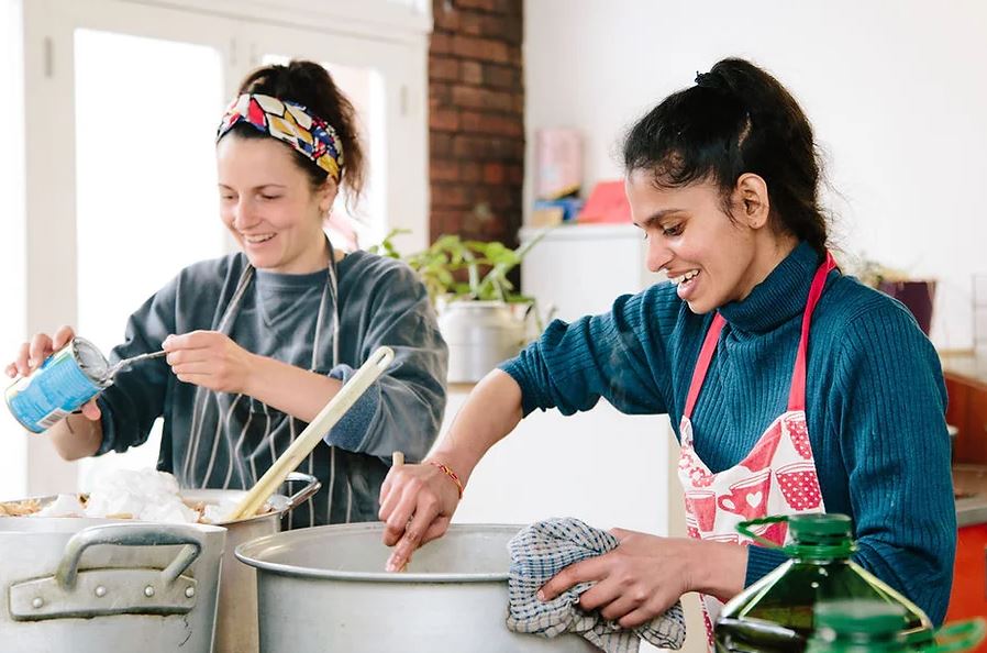 Two women cooking in a kitchen