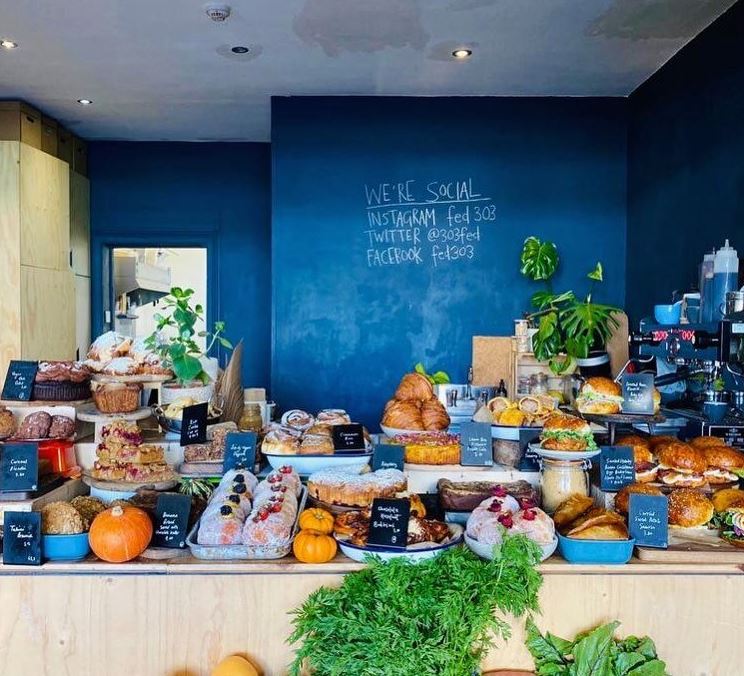 Counter packed with cakes and rolls