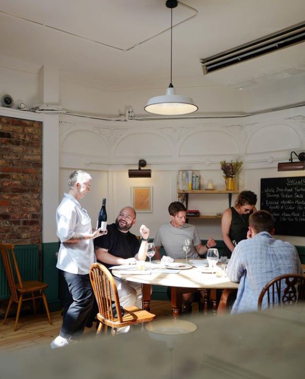 People sat at table in pub