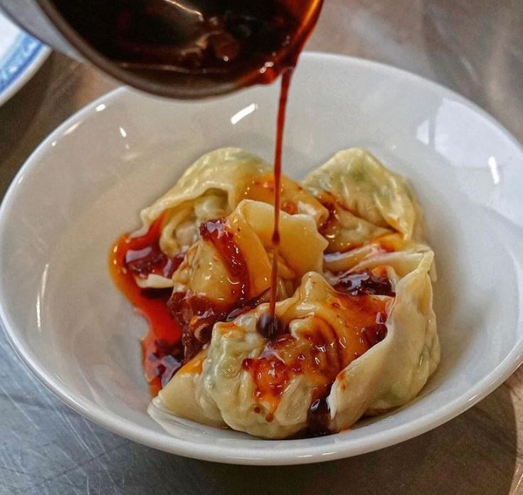 sauce poured over chinese dumplings