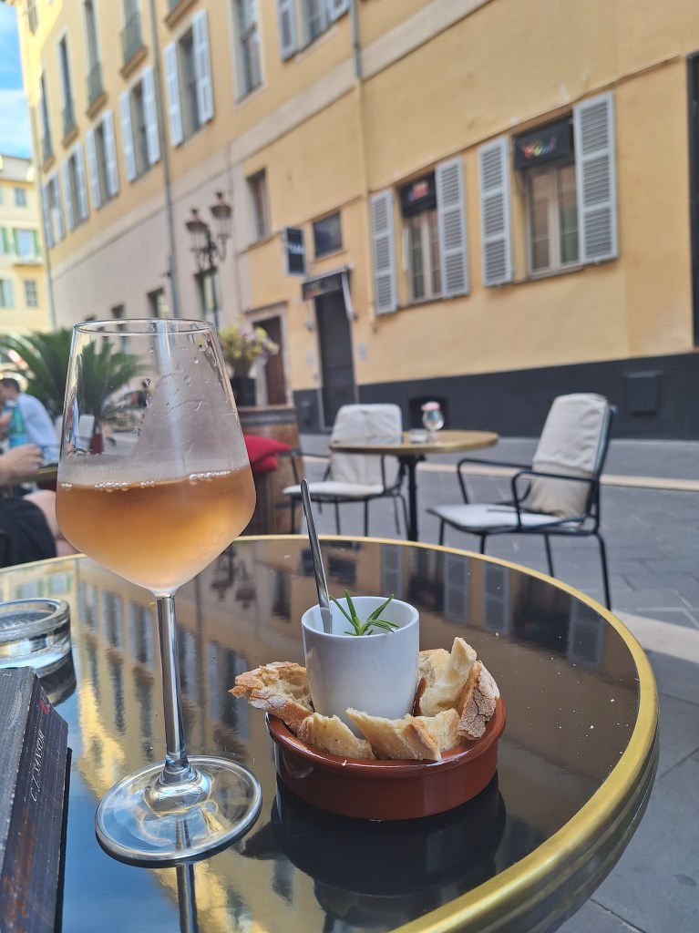 Glass of rose and a snack