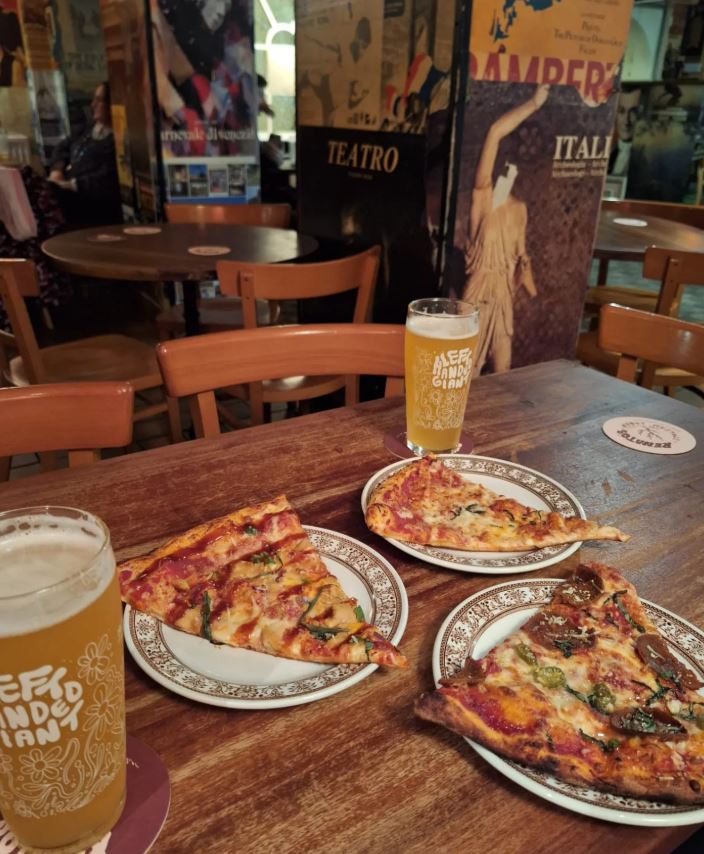 Pizza slices and beer at Renato's