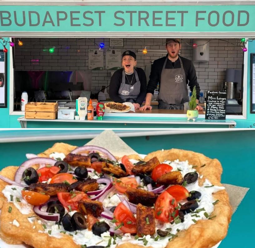 Langos held up in front of street food van