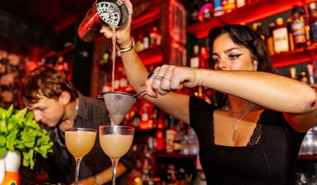 Woman pouring cocktails