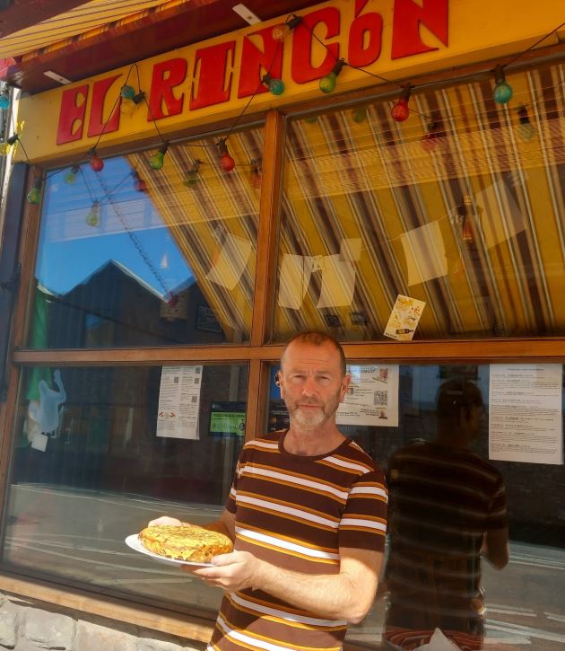 Man holding potato tortilla